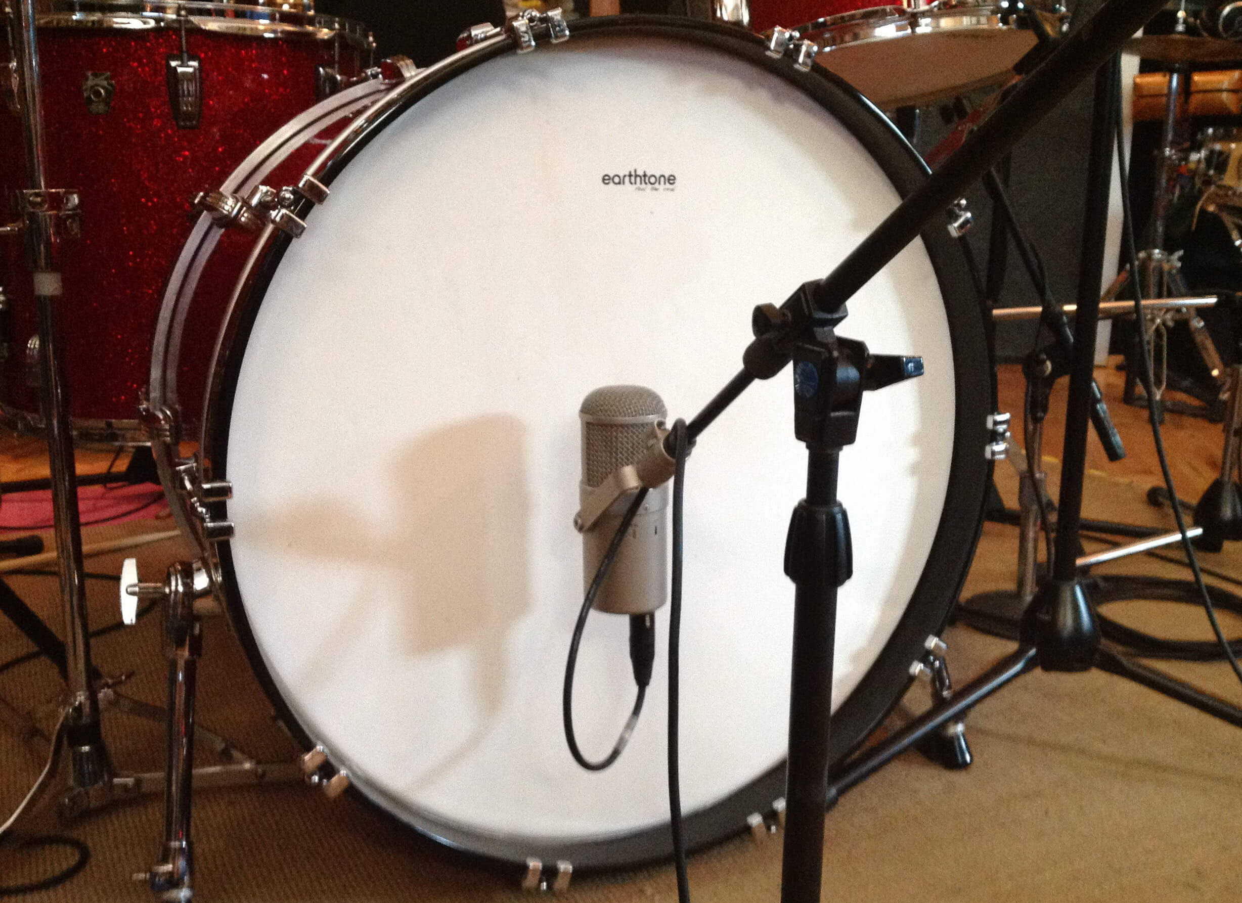 An Earth Tone Drum Head mounted on a vintage bass drum